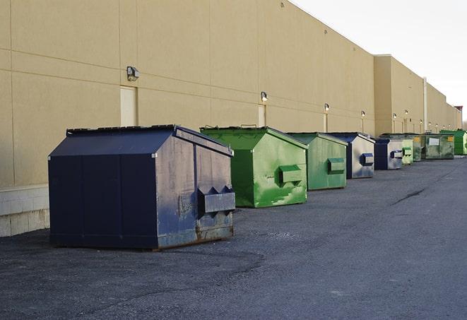 a row of heavy-duty dumpsters ready for use at a construction project in Burlington IL